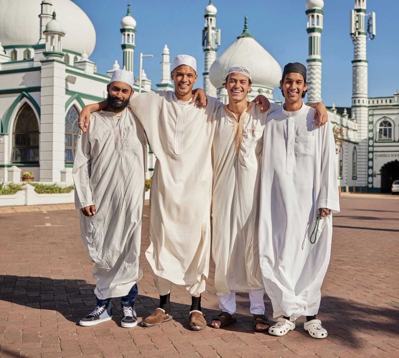 happy hajj and muslim men at a mosque to pray ramadan faith and group in mekka together smile r.jpg